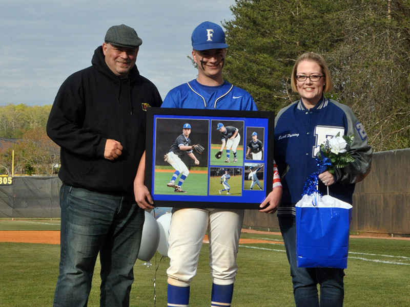 The Fannin County Rebels baseball team celebrated seven senior Rebels between games against Chattooga Friday, April 23. Senior Jacob Preising is shown with his parents Dave and Kelly Preising.