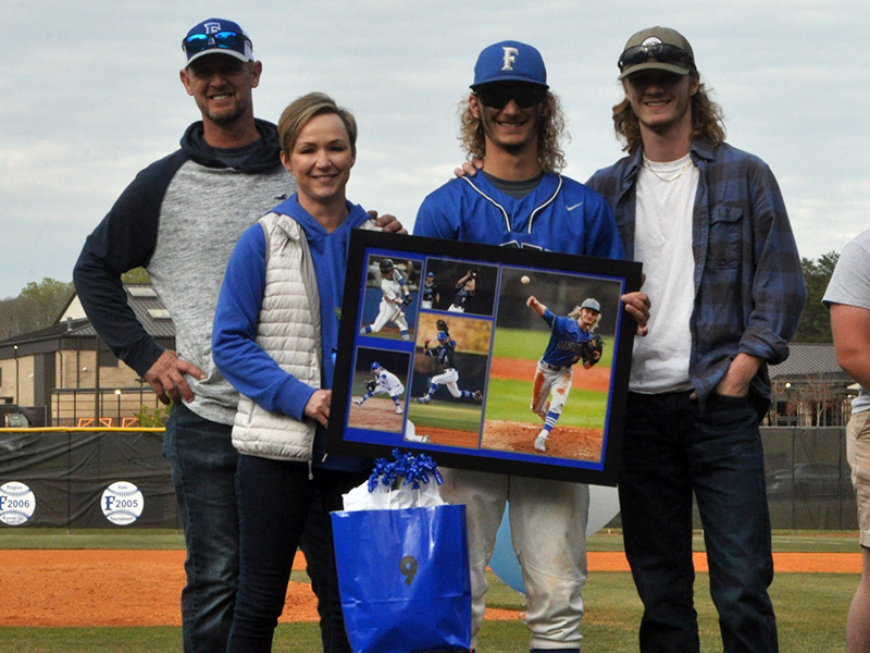 Fannin County baseball honored Wyatt Rogers along with seven other seniors at the Rebels senior night ceremony Friday, April 23. Shown are, from left, Buddy Rogers, father; Christine Rogers, mother; senior, Wyatt Rogers; and Garrett Rogers, brother.