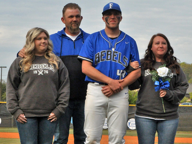The Fannin County Rebels baseball team celebrated seven senior Rebels between games against Chattooga Friday, April 23. Shown during the ceremony are, from left, Tori Hughes, sister; Dusty Hughes, father; senior, Logan Hughes; and Crystal Hughes, mother