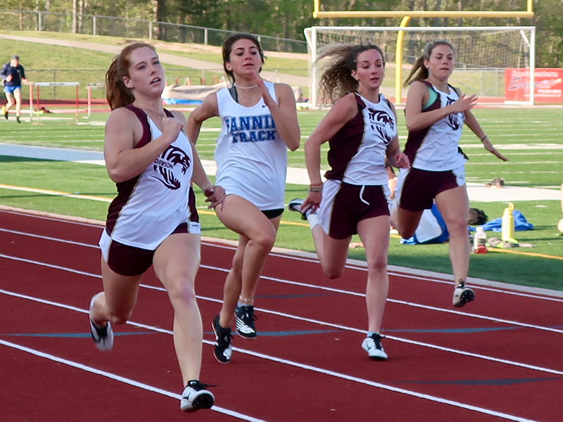 Monica Cosentino, second from left, is shown competing the 200 Meter Dash in recent action for the Lady Rebels.