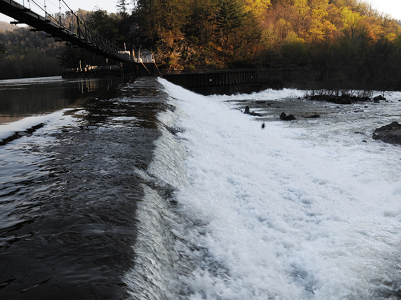 The effect of TVA's water releases from the Blue Ridge Lake dam can be seen in the Ocoee River as water flows over the wooden dam below the Ocoee #2 powerhouse.