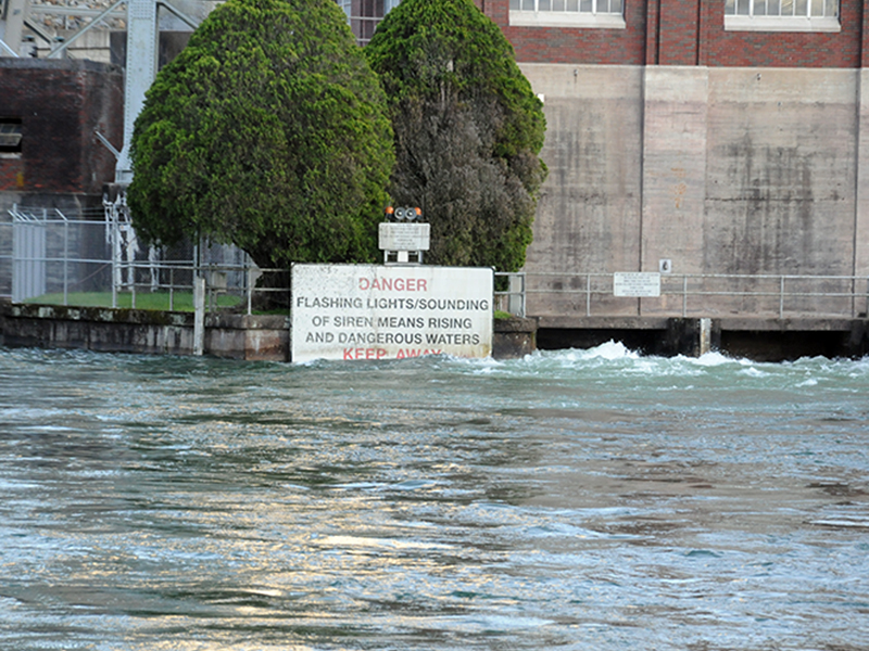 The effect of the amount of water being released through Blue Ridge Lake Dam by TVA is obvious as it rises above the bottom of the sign warning river users to be aware of rising and dangerous waters.