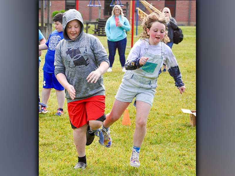 West Fannin Elementary School third-grade students Luke Sosebee and Ella Lackey compete in the three-legged race during field day Thursday, May 13.
