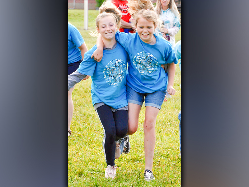 Fifth-grade students Ayla Walton, left, and Addyson Plott compete against their peers during West Fannin Elementary School’s field day Thursday, May 13.