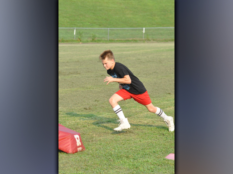 Christopher Kraft works on his leverage during the Copper Basin High School football team’s youth football camp Thursday, July 22.