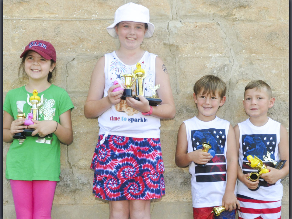 The Great American Duck Race took the winners of the three heats and then raced for the first place trophy. The winners of the Great American Duck Race are, from left, Kariyana Donev, first place; Taber Pass, second place; Kaison Boring, fourth place; and Owen Mull, third place.