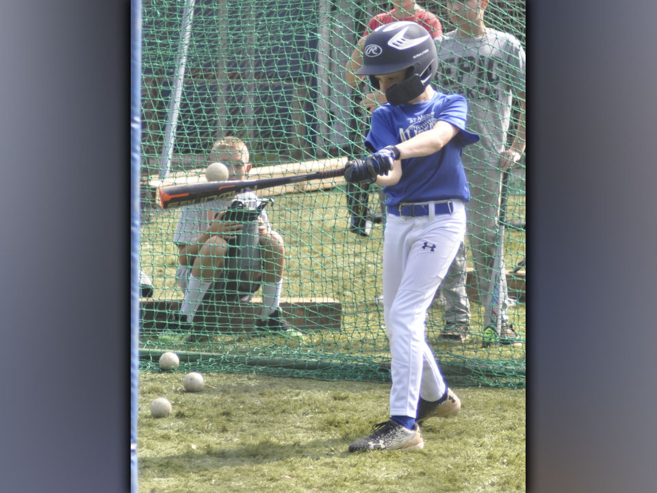 Aiden Owensby works on his batting technique during hitting camp hosted by the Fannin County High School baseball team.