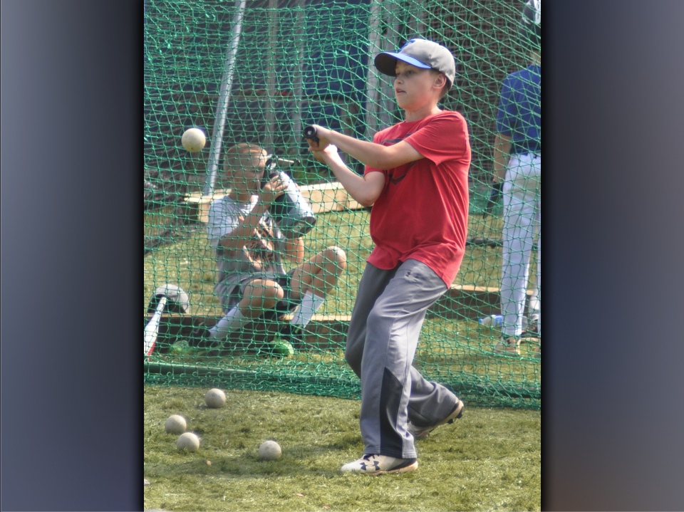 Ethan Owensby crushes a ball during hitting camp at the Fannin County High School batting cages Wednesday, July 14.