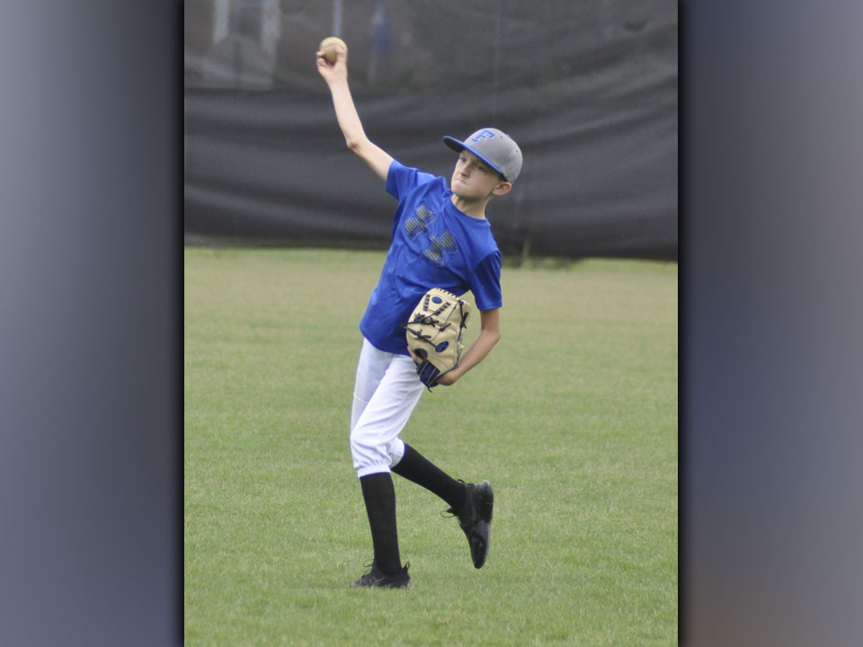 Carson Callihan uncorks a pitch. He was showing off his skills when the Fannin County High School baseball team hosted a recent camp.