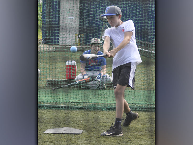 Heath Bradburn connects on a pitch during Fannin County High School baseball’s hitting camp Wednesday, July 14.