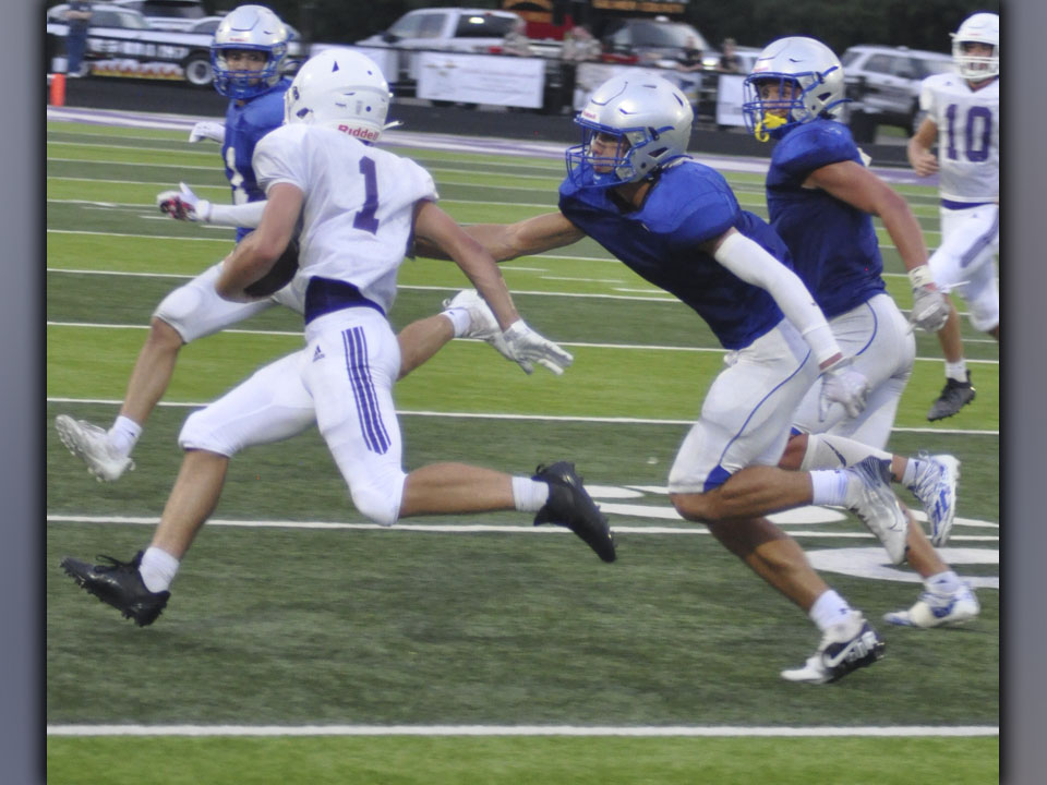 Hayden Lynch (middle) and Cason Owenby (far right) chase down a Gilmer County ball carrier during the Rebels and Bobcats’ preseason scrimmage Friday, August 6. Lynch and Owensby had a great game on both sides of the ball.