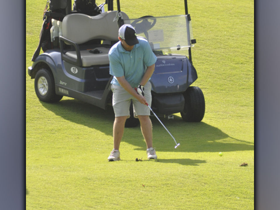 Matthew Johnson pushes the ball to the green during the Fannin County Football Golf Tournament Tuesday, July 27.