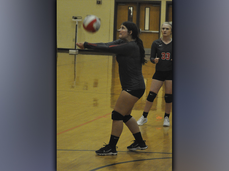 Ally Foster keeps a volley alive during the Lady Cougars volleyball game against Meigs County Tuesday, September 7.