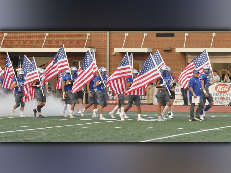 The Fannin County Rebels had a patriotic entrance in their game against Southeast Whitfield Friday, September 10. All the players came out with American flags to start the game.