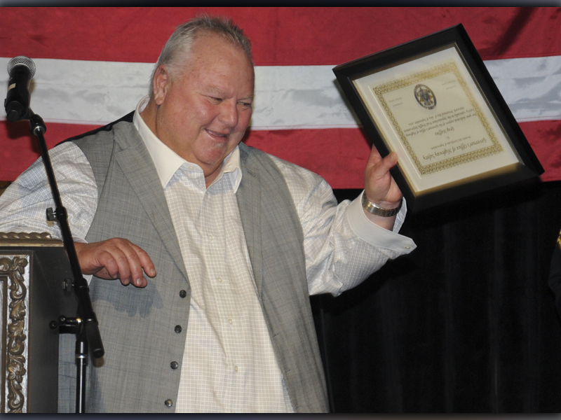Greg Staffins offers a gesture of appreciation to the crowd after receiving a special Award of Appreciation from the Governor’s Office of Highway Safety at the GOHS Quad Network Banquet in McCaysville last week.