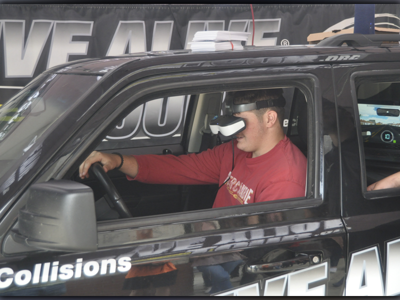 Addison Hook attempts an intoxicated driving simulation during the Arrive Alive Tour at Copper Basin High School Thursday, September 30.