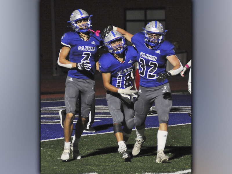 Hayden Lynch (2) celebrates with Austin Garland (18) and Isaac Davis (32) after Garland muscled his way to paydirt on a touchdown run to extend Fannin’s lead over Chattooga Friday, October 22.