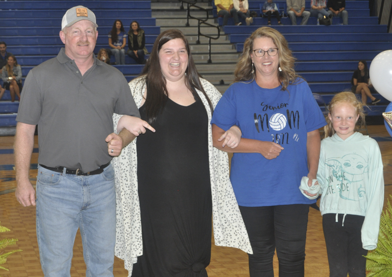 Kalliee Stanley was honored during the Lady Rebels volleyball senior night Tuesday, October 5. Stanley is shown with her “second family” Donnie, Jill and Katelyn Kendall.