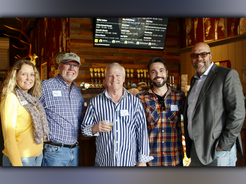 Jahna Allen with ReMax Town & Country, chamber member Mike Wick, Vitor Silva and Steve Tucker with ReMax Town & Country and chamber ambassador Troy Shirbroun pause their conversation for a quick picture at the Fannin County Chamber of Commerce Business After Hours event Tuesday, October 19, at Grumpy Old Men Brewing.