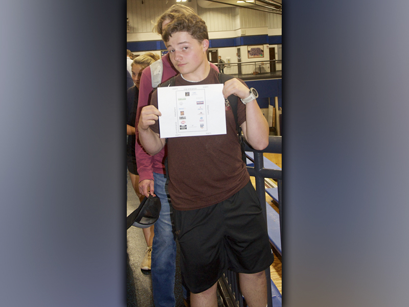 Perusing the options, Dawson Acuff holds up the map of the Job Fair that was organized by the Fannin County Development Authority for Fannin County High School students seeking part-time positions.