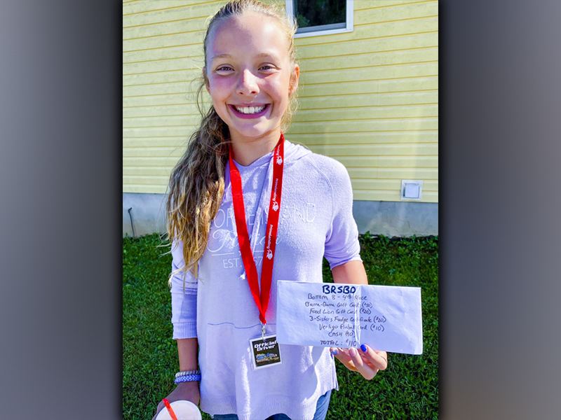 Brooklyn Owenby holds up her winnings after placing fourth in the Bottom 8 Bracket of the Blue Ridge Soap Box Derby that took place Saturday, September 25.