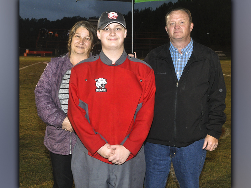 Copper Basin band senior Chase Green was recognized Friday, October 29, before the Cougars last home football game of the season. Green is shown with his parents Matt and Bobbie Green.