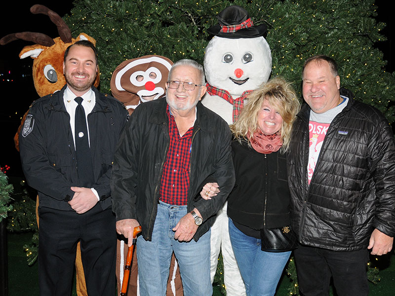 “River Friday” kicked off the Christmas season in McCaysville Friday, November 26. Following the lighting of the Christmas tree, from left, McCaysville Police Chief Michael Earley, Mayor Thomas Seabolt, and Barbara and Mike Galinski were all smiles. The tree lighting was sponsored by the McCaysville Business Association.