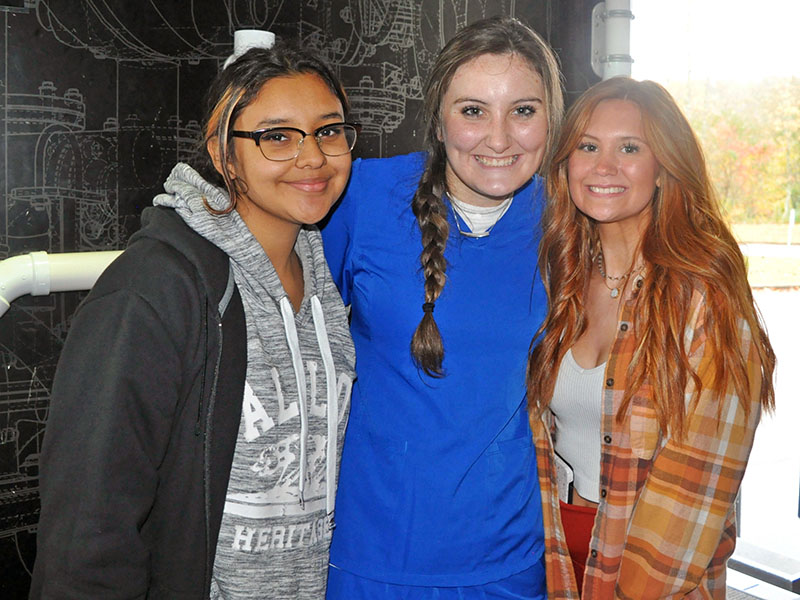After successfully completing the plumbing challenge Thursday, November 4, Fannin County High School students, from left, Lizabeth Acevedo, Erin Gonzales and Olivia McAllister are all smiles. 