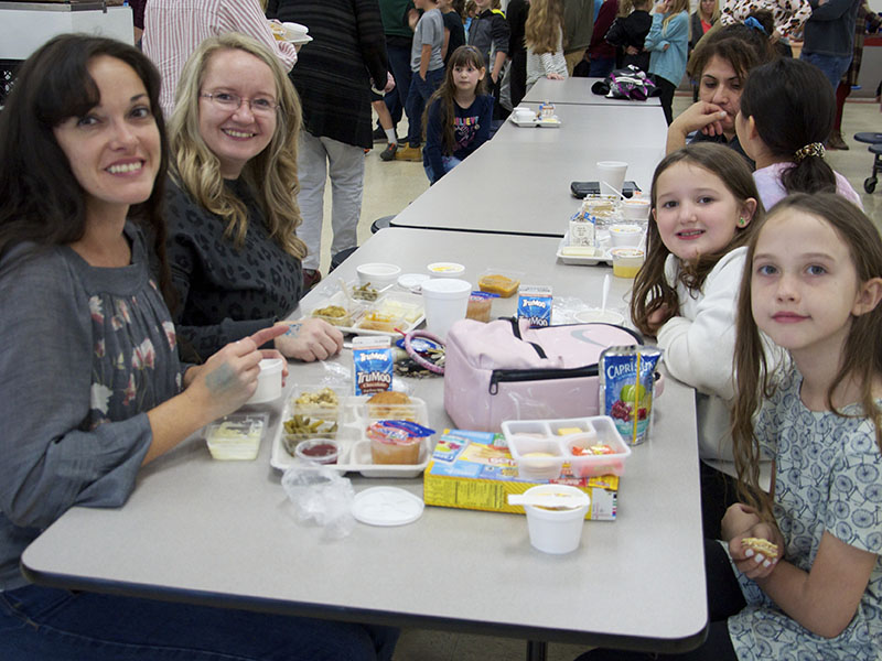 Blue Ridge Elementary School allowed parents and guardians to come enjoy a Thanksgiving lunch with their students Thursday, November 17. Eating are, from left, front, Angel Hughes and Elsie and, back, Jessica Thomas and Serah.