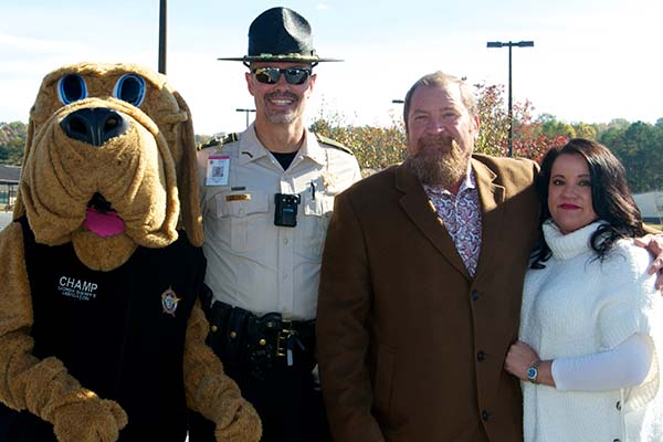 Many patriots attended the Veterans Day Ceremony at the Fannin County Veterans Memorial Park Saturday, November 6. Among a sea of people are, from left, CHAMPS mascot James Burrell, School Resource Officer Darvin Couch, Blue Ridge councilman-elect Jack Taylor and Tonya Nuelle.