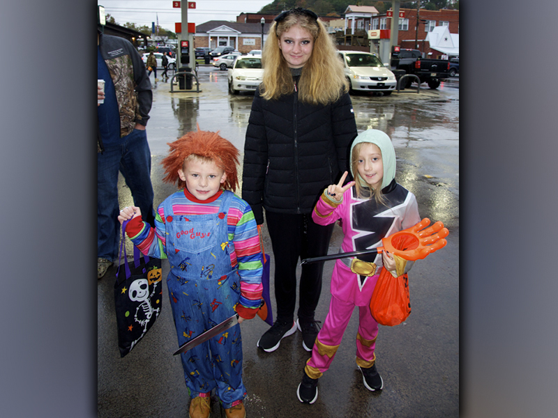 Case Harrison as Chucky, Winter Mcclananan as a pink Power Ranger and Toni Harrison as a black cat didn’t mind braving the rain and cool temperature in exchange for some candy during McCaysville and Copperhill’s Halloween Safe Zone Friday, October 29.