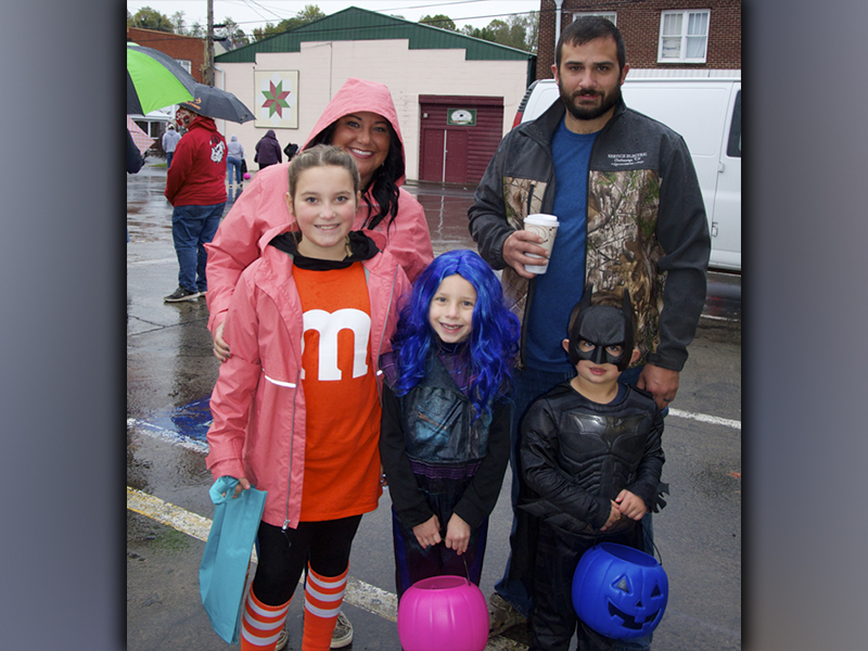 The rain and chill didn’t stop folks from getting out and trick or treating in McCaysville and Copperhill Friday, October 29. Among the ghosts and goblins are from left, front, McKinzee Easterling, Alivia Hyatt and Cutler Morris; back, Amber Henderson and Damon Morris.