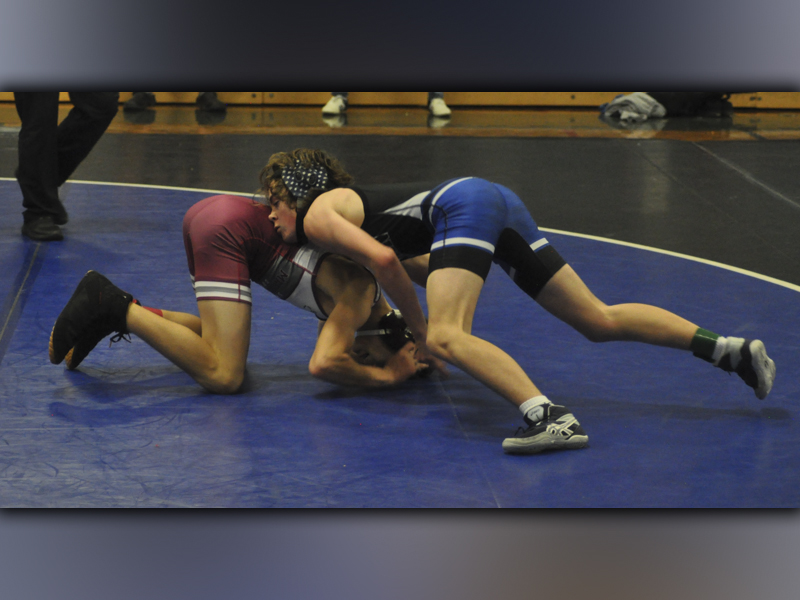 Landon Poole battles to pin his opponent in recent action for the Fannin County High School wrestling team.