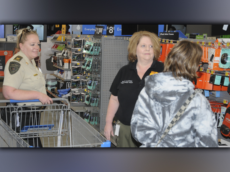 Captain Jill Huffman, left, and Dispatcher Melissa Stonecipher helped a young lady during Shop With a Cop Saturday morning at the Blue Ridge Walmart. A total of 80 youngsters benefited from this year’s program.