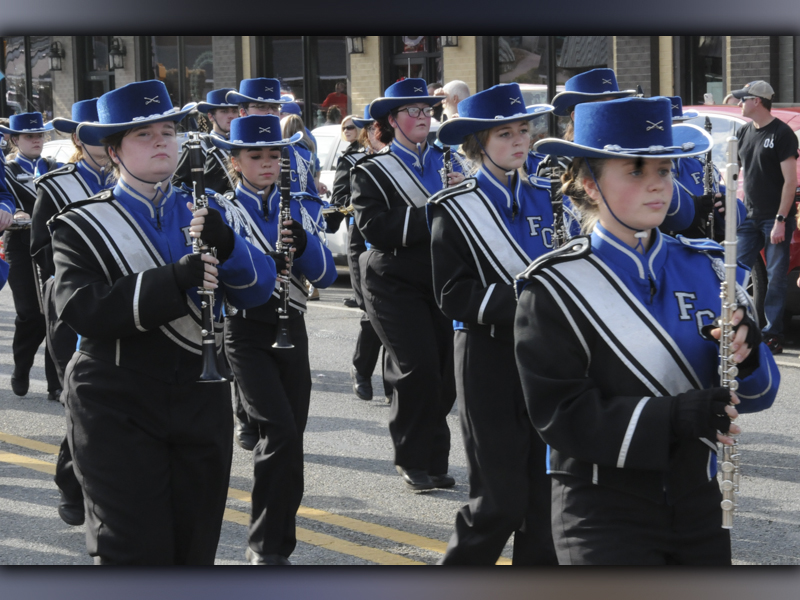 The Fannin County High School Marching Band parades through the twin cities.