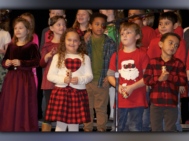 Performing a Christmas song are West Fannin Elementary School students, from left, front, Navaeh Grahl, Sawyer Graham, Julian Rosas and, back, Presley Mealer, Cassie Fowler, August Trammell and William Acevedo.
