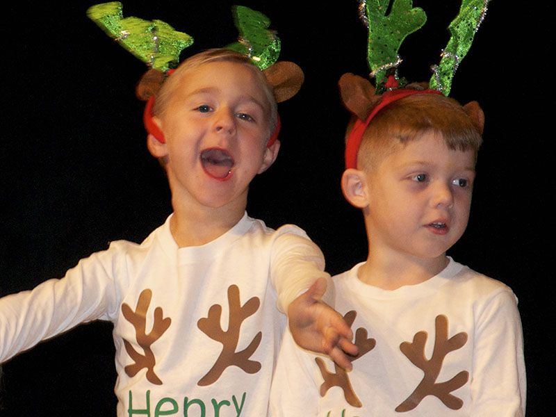 East Fannin Elementary School pre-k students Henry Kinser and Haegen Collis rock the stage during the school’s “A Season of Joy” performances at the high school Performing Arts Center Friday, December 17.