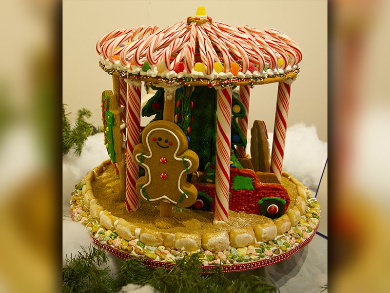 Denise Burns with Wrapsody Outdoor Living snagged first place in the business category of Light Up Blue Ridge’s Gingerbread House Contest with her creation, “Carousel.” Gingerbread creations are on display at The Art Center, 420 West Main Street, Blue Ridge, through December 12.
