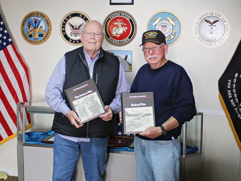 Vietnam veteran John Parrot, left, recently donated 53 books to the Fannin County Veterans Museum. He is shown beside fellow Vietnam veteran Rod McIntyre, representing the museum.