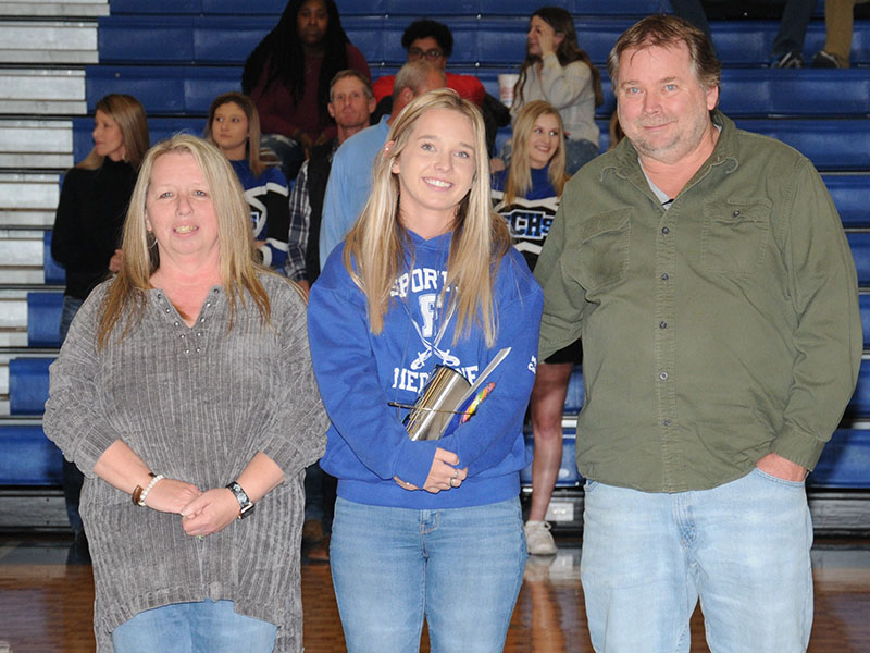 Emily Turner is shown with her parents, Buffy and Eric Turner, during Senior Night at Fannin County High School Friday, January 7. A trainer for all the sports at FCHS, she has been participating with the basketball team for three years.