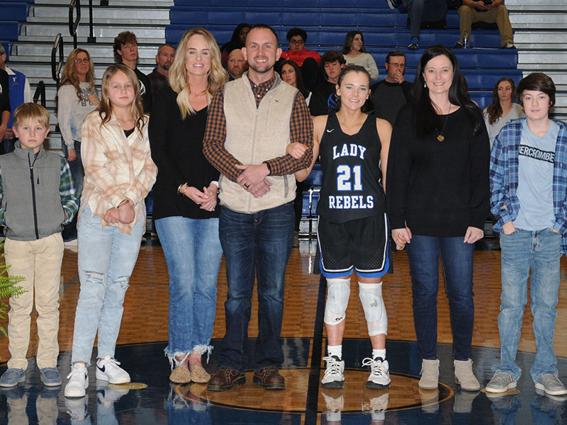 Jenna Young was one of three seniors on the Lady Rebels basketball team honored at Fannin County High School Friday night. A four-year varsity player, she is shown with her family including, from left, brother and sister Mason and Taylyn, step-mother and father Michelle and Jeff Young, mother Rachel Adams, and brother Brody.
