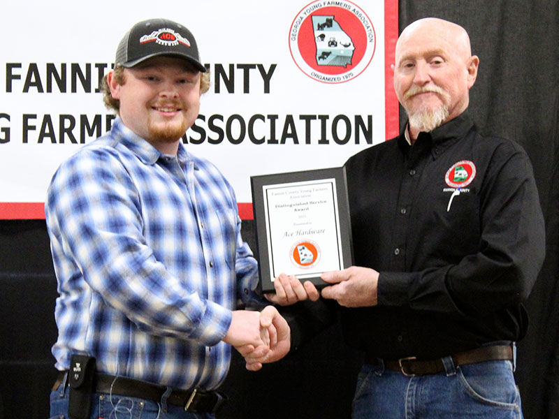 Ace Hardware of Blue Ridge was awarded Distinguished Service Award 2021 at the Fannin County Young Farmers Association (FCYFA) Awards Banquet Friday, February 4. Shown are, from left, Samuel Parks accepting on behalf of Ace and FCYFA President Kenny Queen.