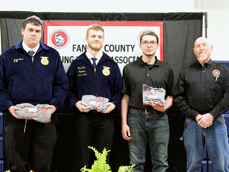 Shown are, from left, Fannin County High School seniors, Kaleb Couch, Evan Fish and Noah Hess being recognized as valuable assets to the future of agriculture and the Fannin County Young Farmers Association (FCYFA) at the fifth annual FCYFA Awards Banquet February 4. They are shown with FCYFA President Kenny Queen.