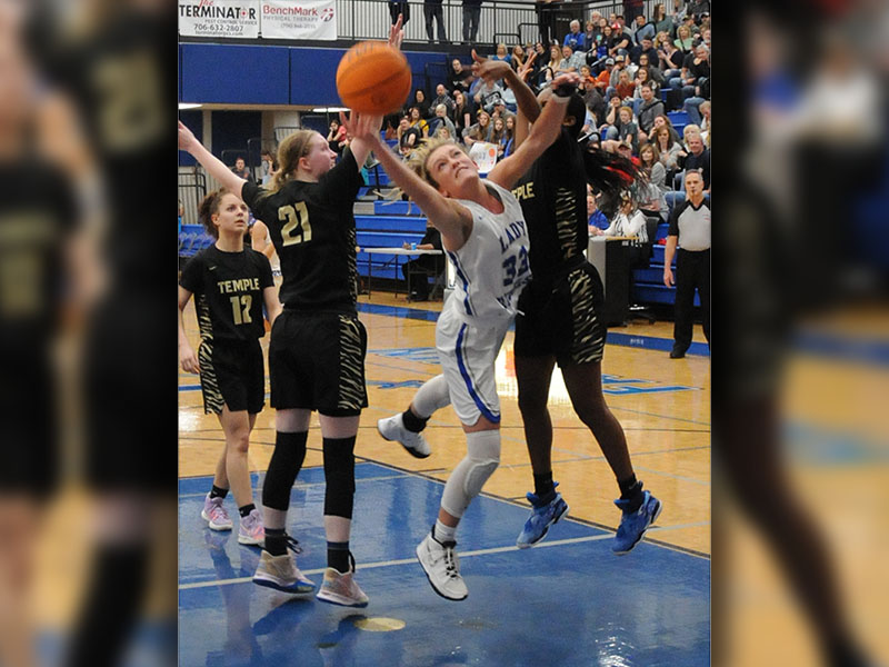Reagan York fights for every rebound, winning the majority of the battles in the state tournament games against Temple and Washington County.
