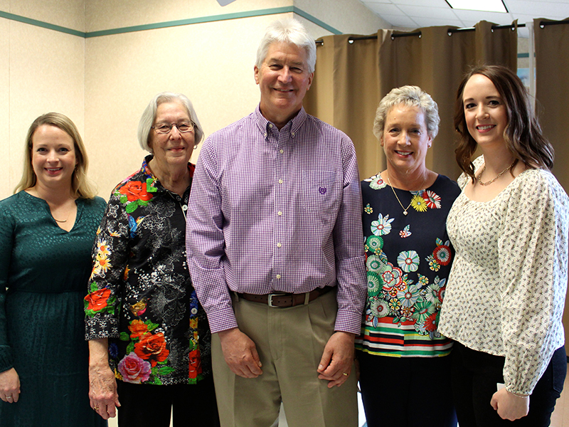 Copperhill native Dr. Garry Day, center, stands with his family Saturday afternoon, February 26, as the community celebrated his 40 years of dedication to the animals of Fannin County and surrounding areas. Shown are, from left, daughter, Emily Day Hodskins, mother, Marilyn Day, Dr. Day, wife, Linda Day, and daughter, Laura Day. “No matter how hard Garry worked or what kind of day he had, he always had time for his daughters when he came home at night,” Linda said.