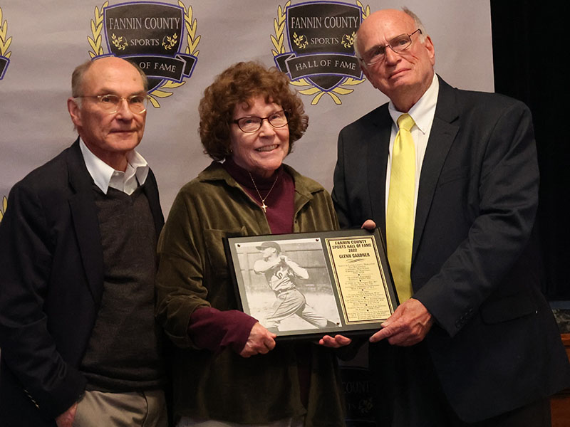 Glenn Gardner’s plaque was received by his son Joe Gardner, left, his daughter, Glenda Wattenbarger, middle, and was presented by Mike Harper, right. 