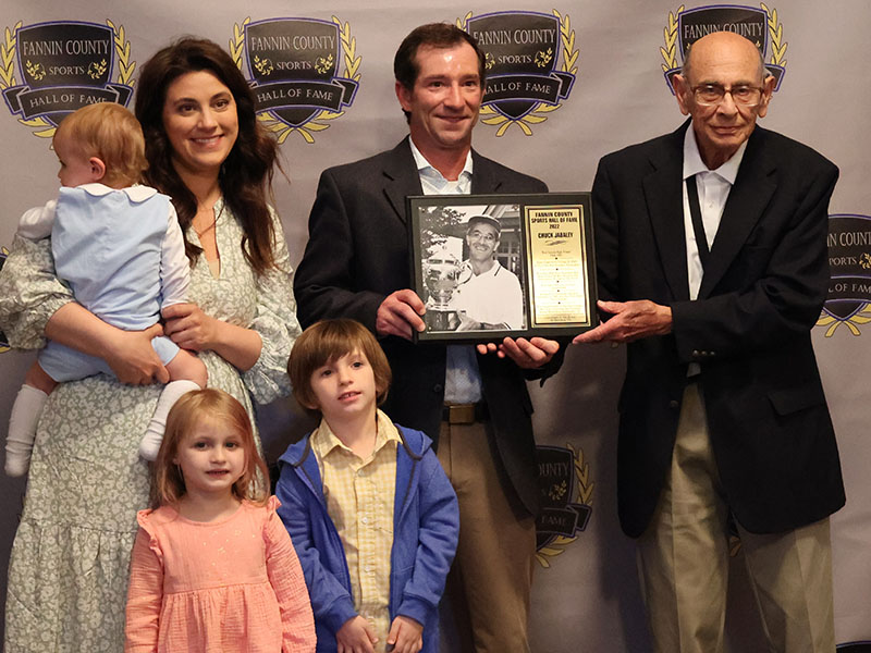 Chuck Jabaley’s plaque was presented to his son Austin Jabaley and family, by Richard Jabaley, right.