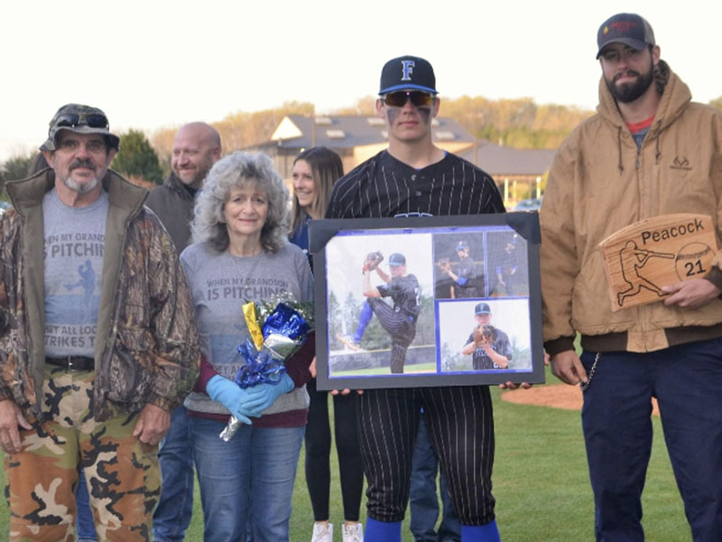Senior Derrick Peacock was escorted by his parents, Richard and Janna Peacock, and his brother Devan Peacock. 