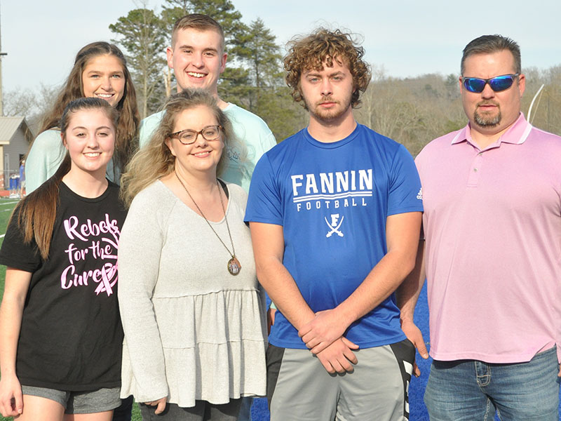 Senior Jackson Davis, shown third from left, was escorted by, from left, front row, sister Courtney Davis, mother Christal Davis, and father Vincent Davis; and back row,  Makenzie McClure and brother Logan Davis.