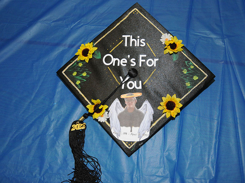 Macy Watkins adorned her GED graduation cap to honor her brother, Gage Dixon, who died unexpectedly at the age of 30. Watkins rested on the foundation of his memory the day she took, and passed, the final part of her GED test.